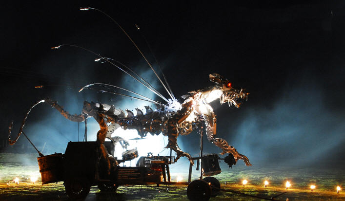 Huge metallic dragon with percussionists