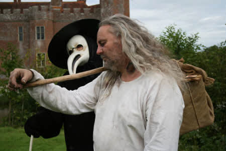 Plague doctor and victim