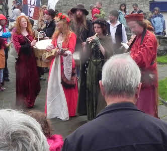 Medieval musicians playing in the street