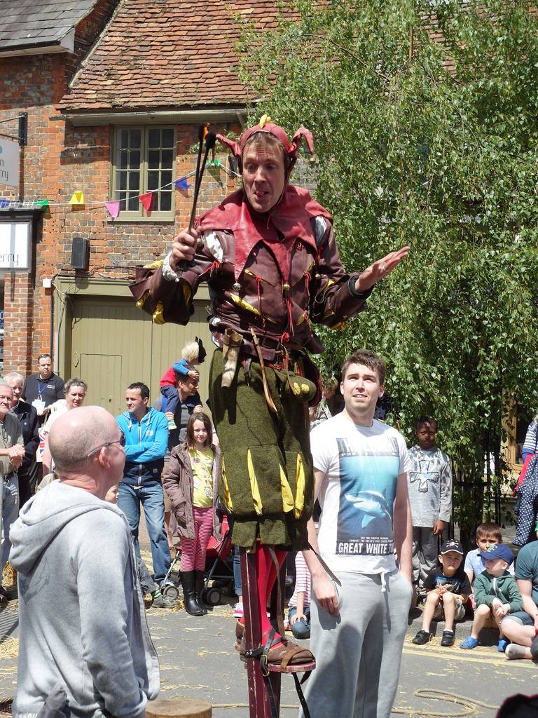Medieval jester on stilts